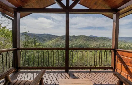Above the Clouds cabin covered deck with panoramic North Georgia mountain views in Blue Ridge Georgia