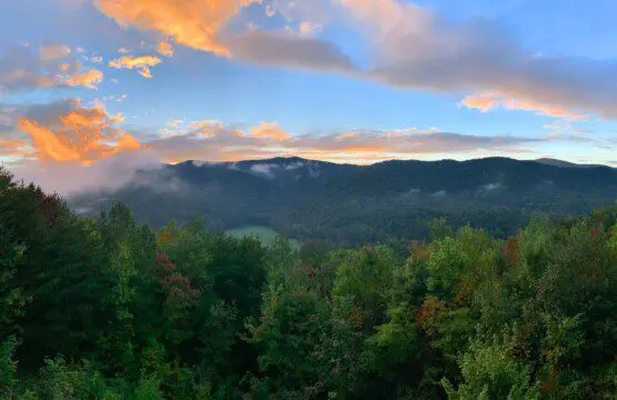 Above the Clouds cabin sunrise view of North Georgia mountain ridgeline with fall foliage in Blue Ridge Georgia