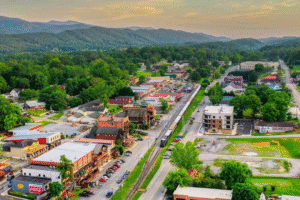 Aerial view of downtown Blue Ridge, GA with mountain backdrop and scenic railway