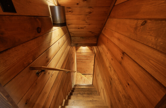 Above the Clouds cabin cedar staircase leading to lower level in Blue Ridge Georgia