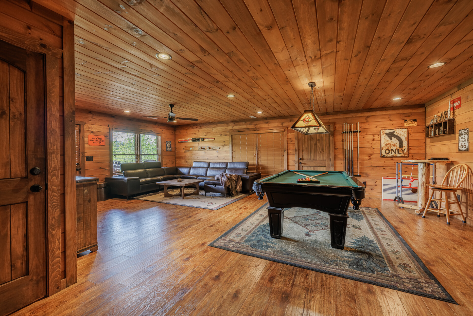 Above the Clouds cabin full game room with pool table sectional and foosball in Blue Ridge Georgia