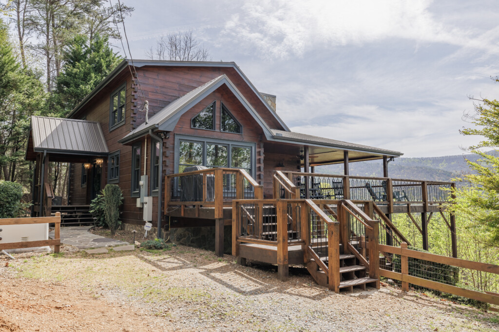 Above the Clouds cabin exterior with wraparound deck and mountain views in Blue Ridge Georgia