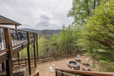 Above the Clouds cabin aerial view of fire pit area and multi-level deck with mountain views in Blue Ridge Georgia